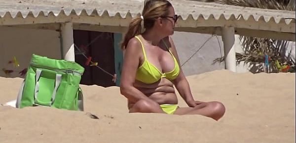  Lady with yellow bikini at the beach